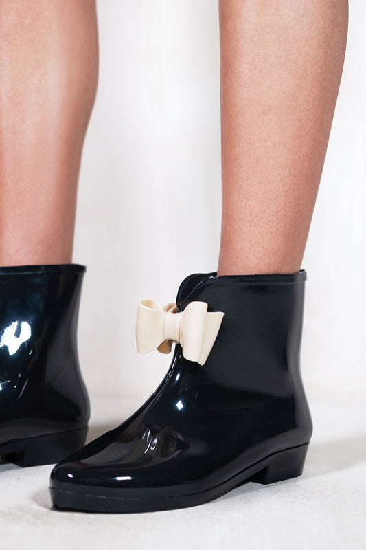 TRISH LOW HEEL ANKLE WELLIES WITH NUDE BOW IN BLACK PATENT FAUX LEATHER