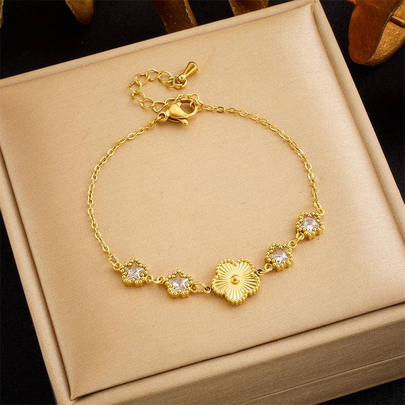 Bracelet en acier titane avec fleur à cinq pétales et coquillage pour femme