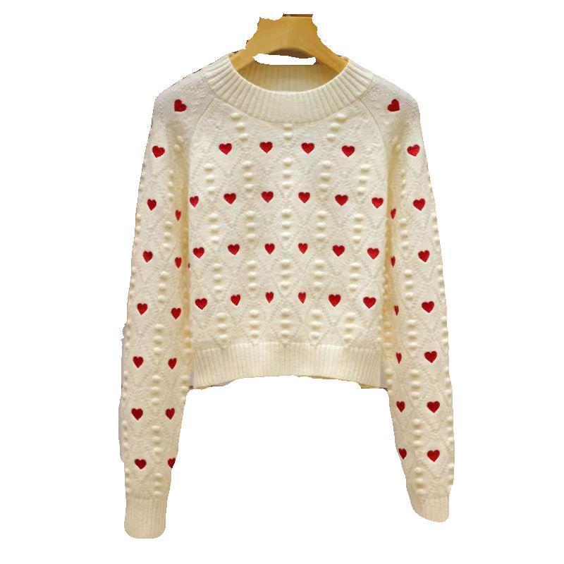 Pull en maille torsadée femme imprimé cœurs