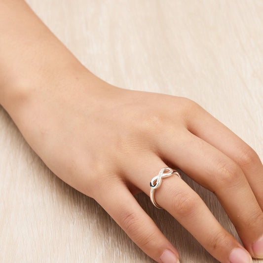 Silver Plated Infinity Ring Created with Zircondia® Crystals