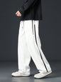Pantalon homme avec cordon de serrage à la taille et bande contrastante sur les côtés