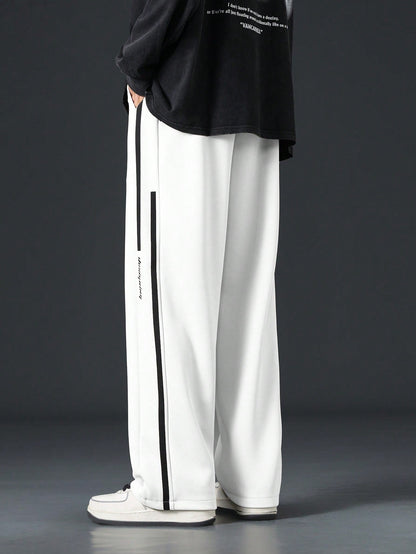 Pantalon homme avec cordon de serrage à la taille et bande contrastante sur les côtés