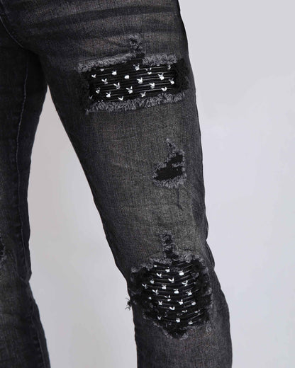 Black Ripped Jeans with Striking Black Patches