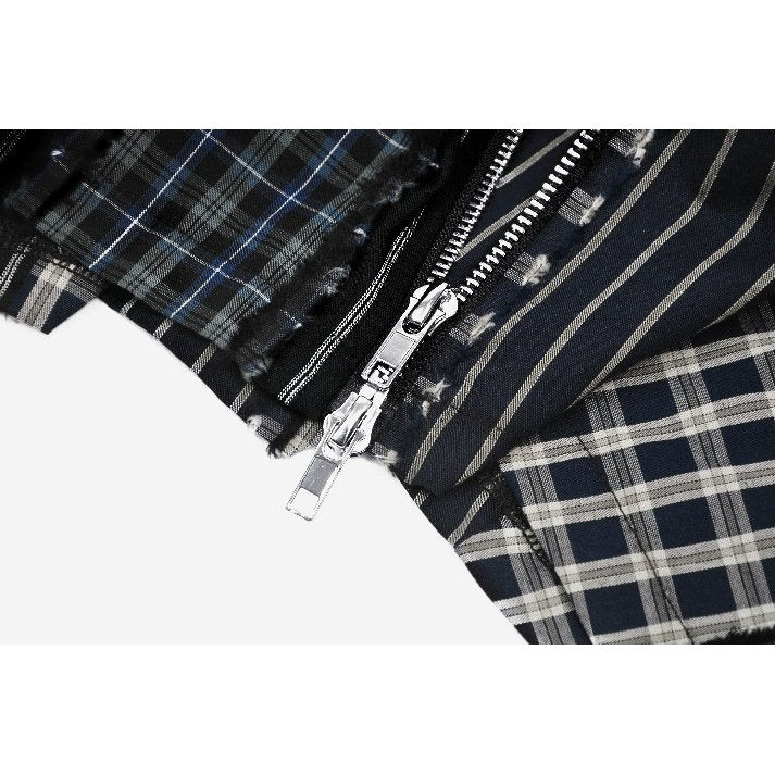 Mini-jupe plissée Dark in Love en patchwork tartan sauge et taille en cuir