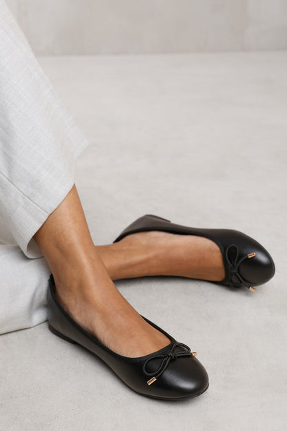 BEXLEY SLIP ON FLAT PUMPS IN BLACK FAUX LEATHER