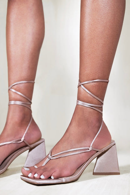 TEAGAN STRAPPY PYRAMID BLOCK HEEL SANDAL WITH LACE UP DETAIL IN CHAMPAGNE SILK