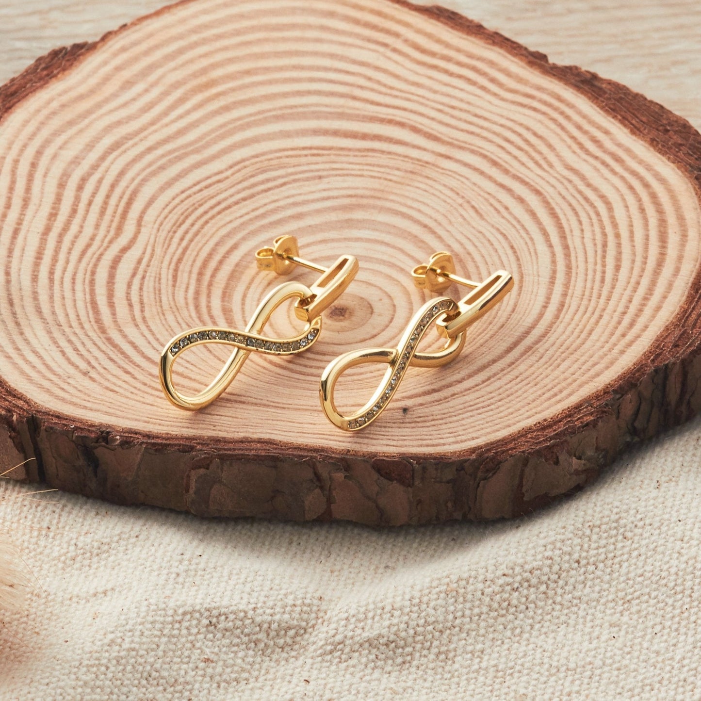 Gold Plated Infinity Drop Earrings Created with Zircondia® Crystals