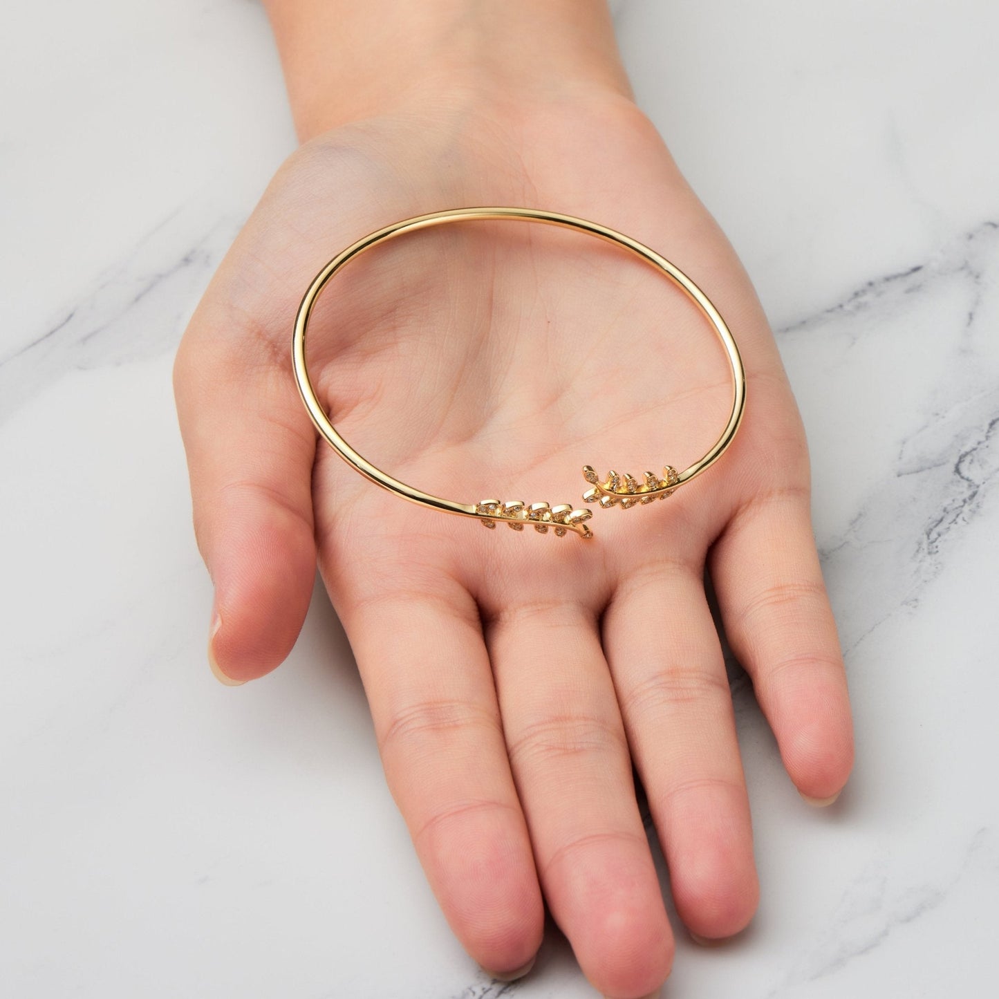 Gold Plated Leaf Bangle Created with Zircondia® Crystals