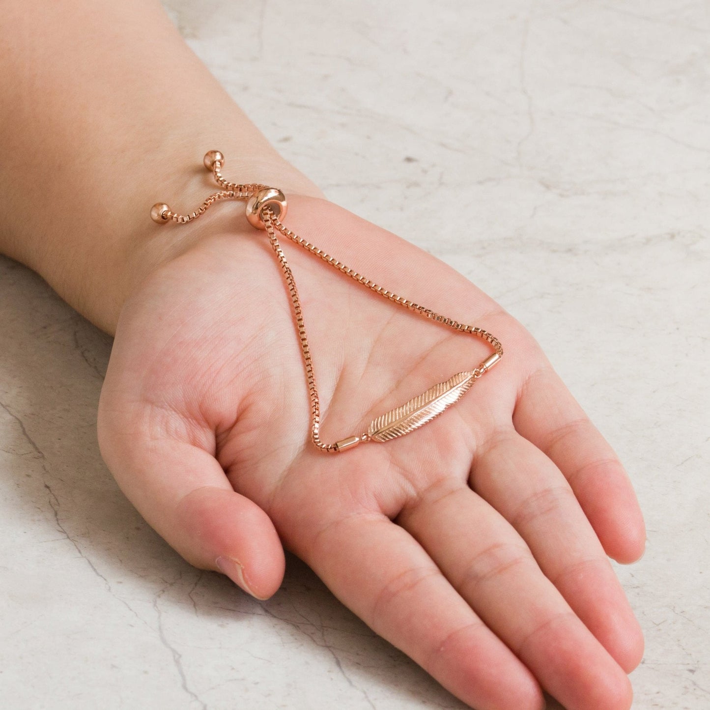 Rose Gold Plated Feather Friendship Bracelet Created with Zircondia® Crystals