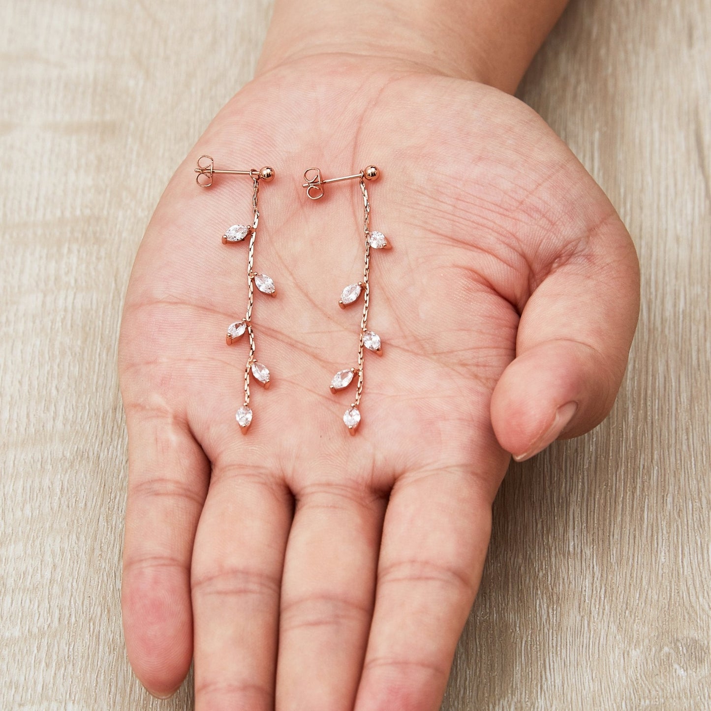 Rose Gold Plated Leaf Dangle Earrings Created with Zircondia® Crystals