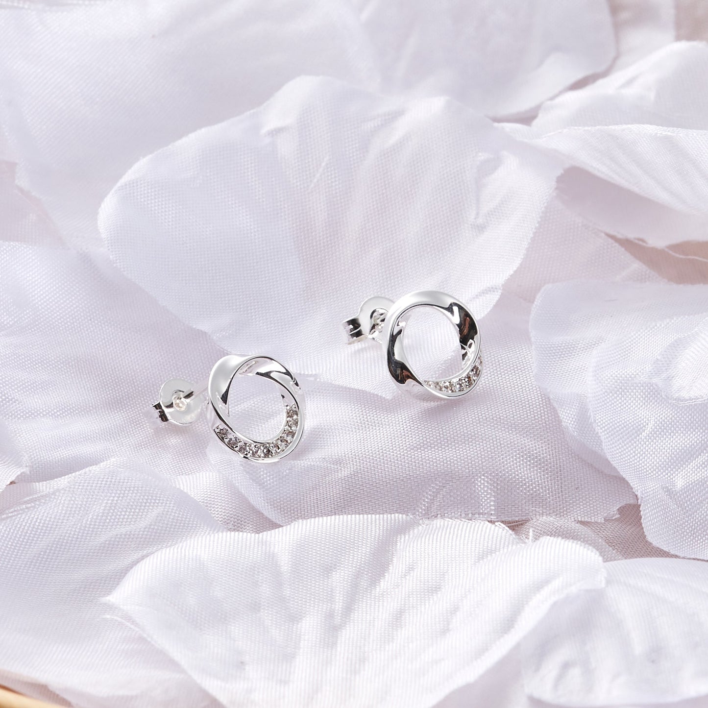 Silver Plated Circle Twist Earrings Created with Zircondia® Crystals