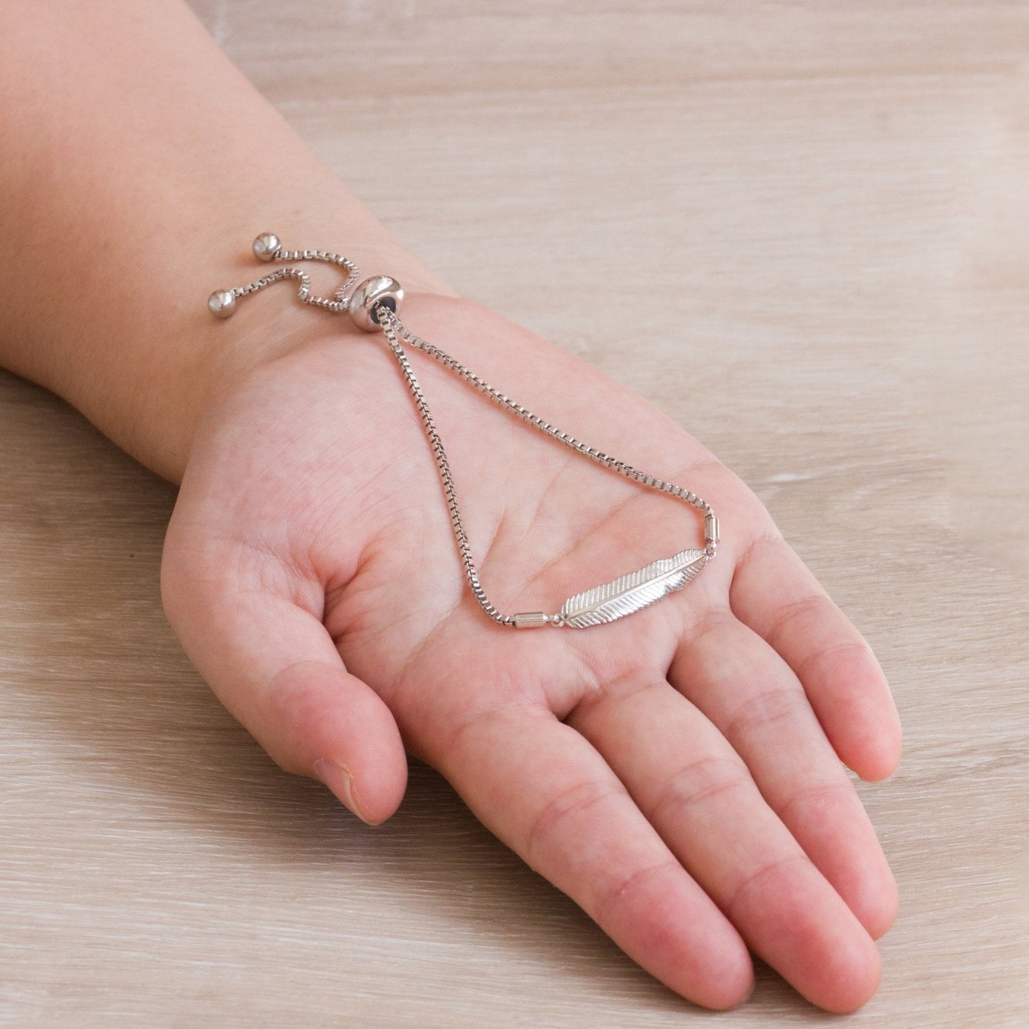 Silver Plated Feather Friendship Bracelet Created with Zircondia® Crystals