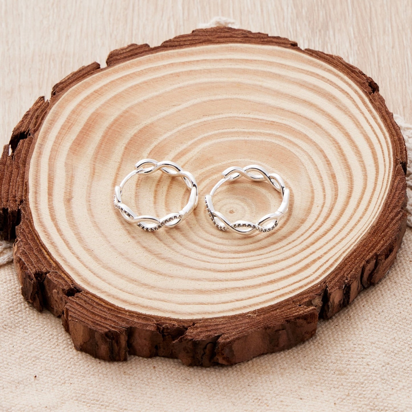 Silver Plated Infinity Hoop Earrings Created with Zircondia® Crystals