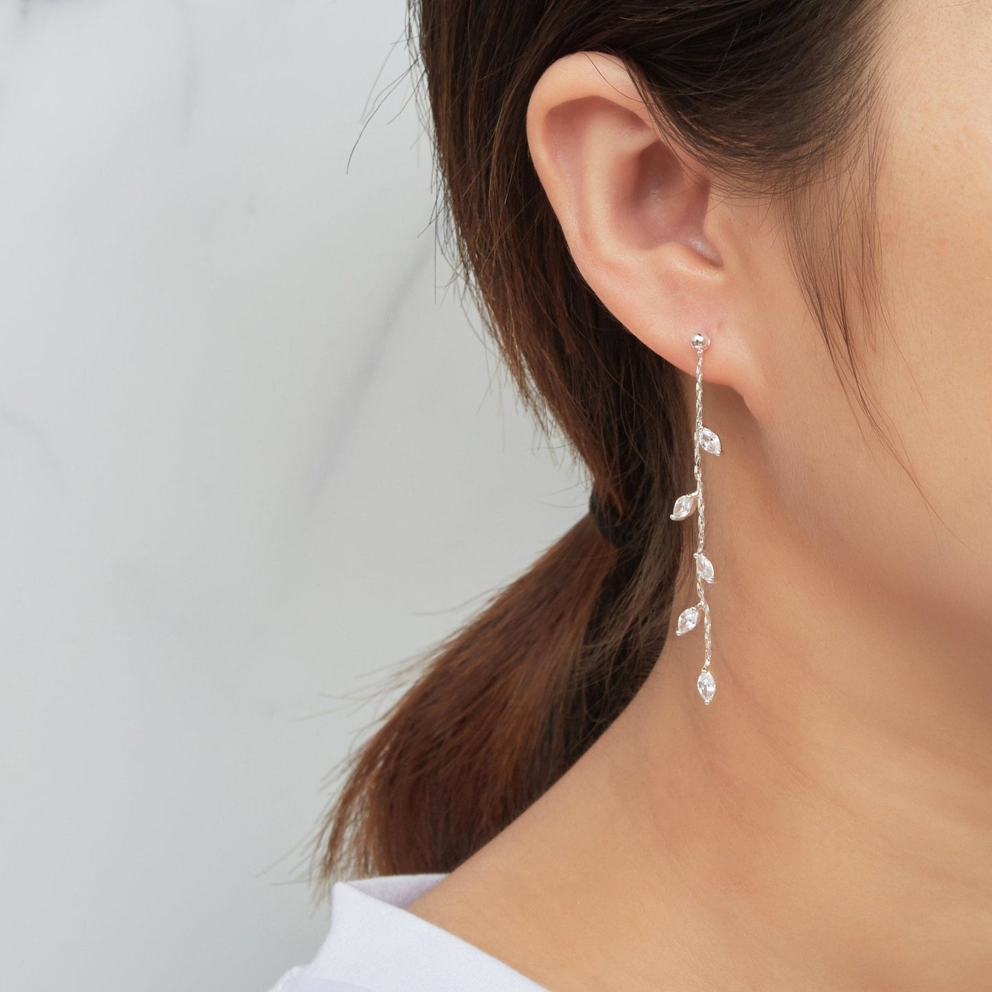 Silver Plated Leaf Dangle Earrings Created with Zircondia® Crystals