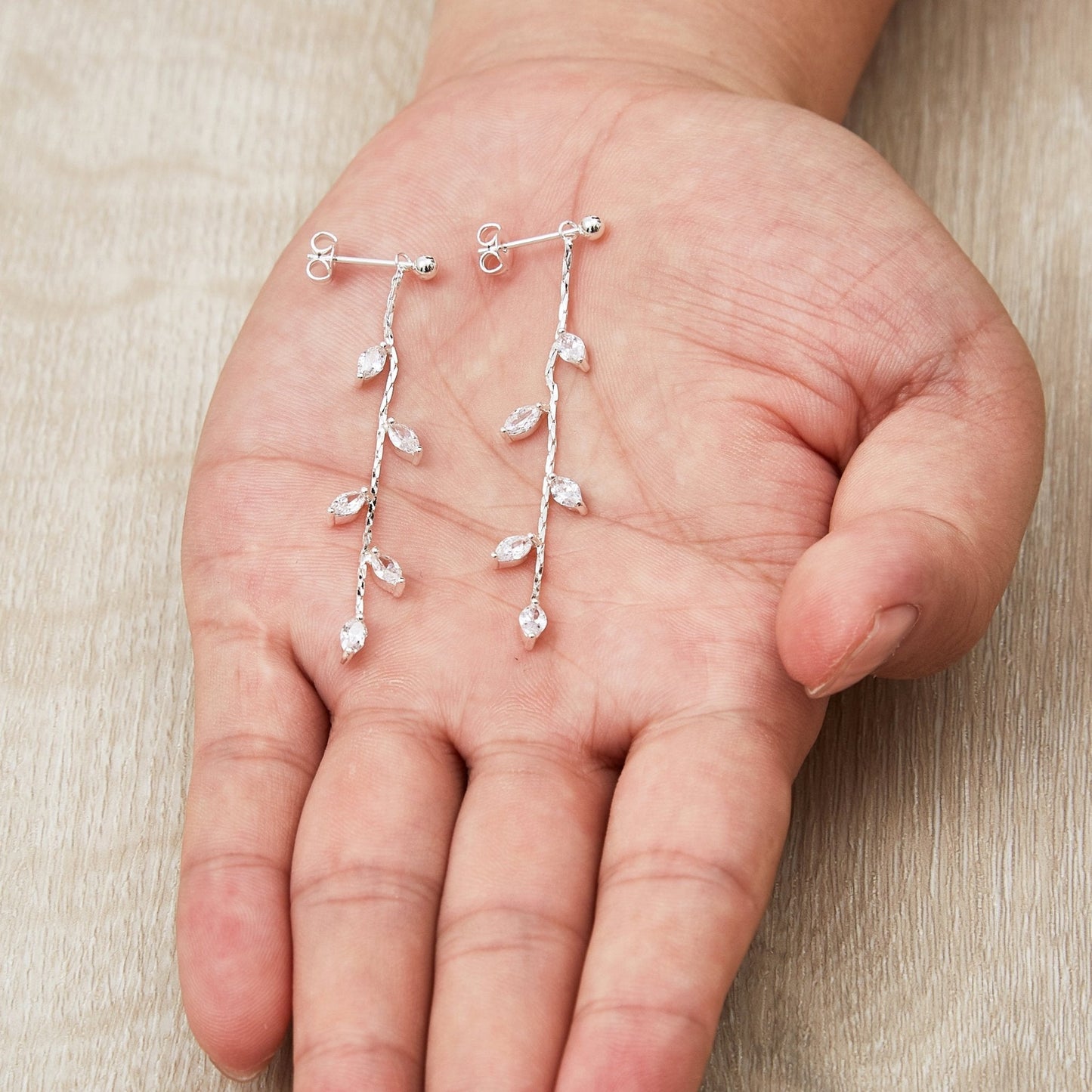 Silver Plated Leaf Dangle Earrings Created with Zircondia® Crystals